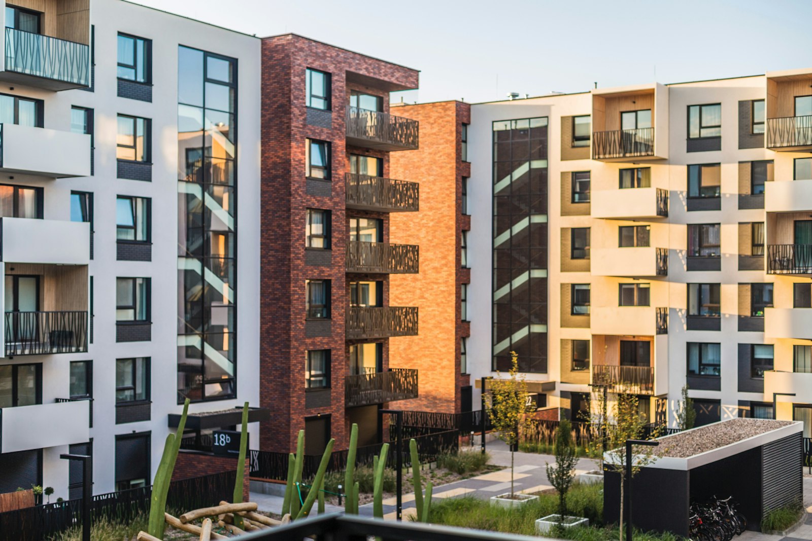 Modern apartment blocks with balconies at golden hour