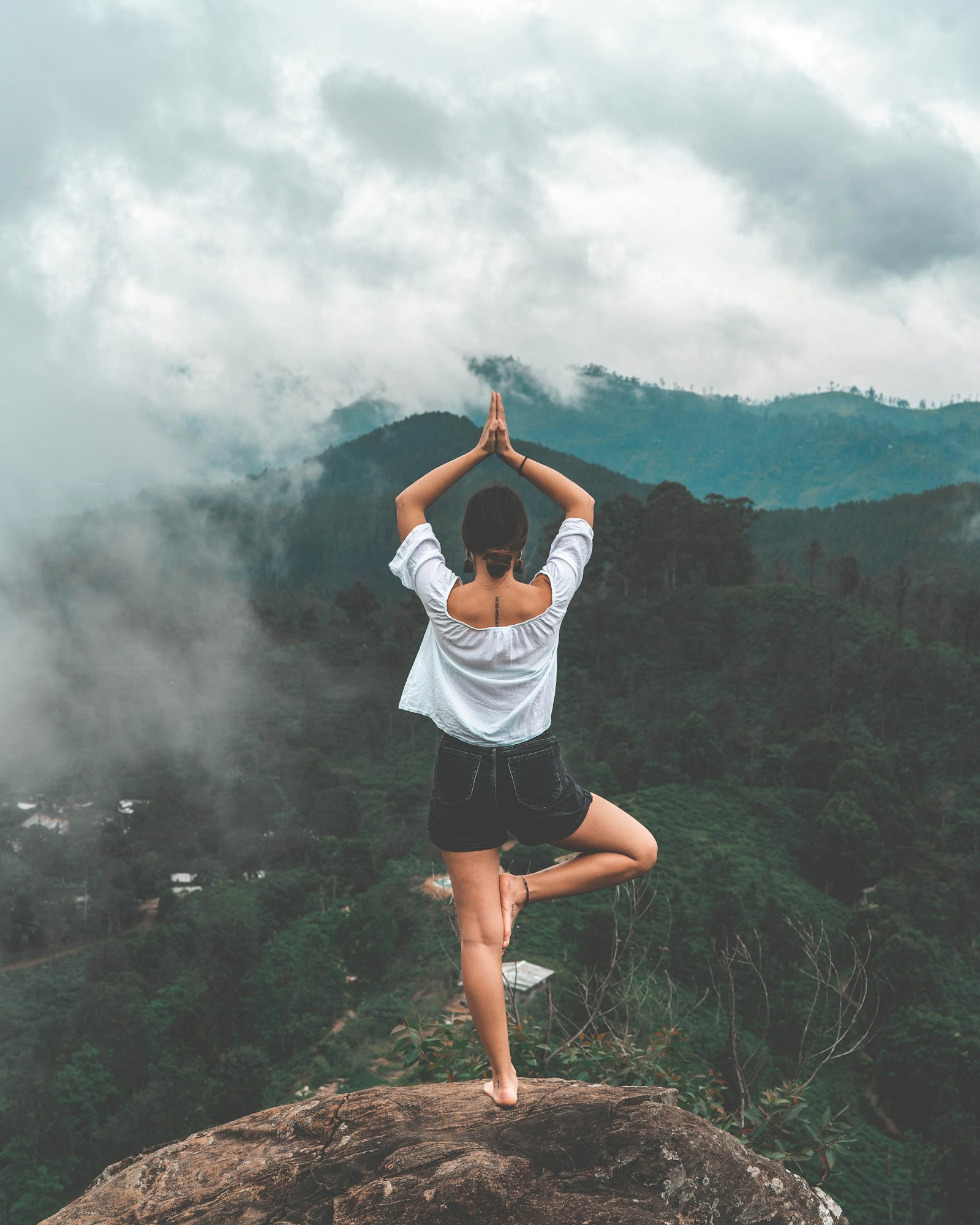 Arms raised to the sky outdoors