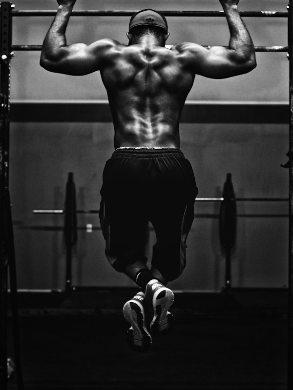 Hooded athlete from behind, monochrome