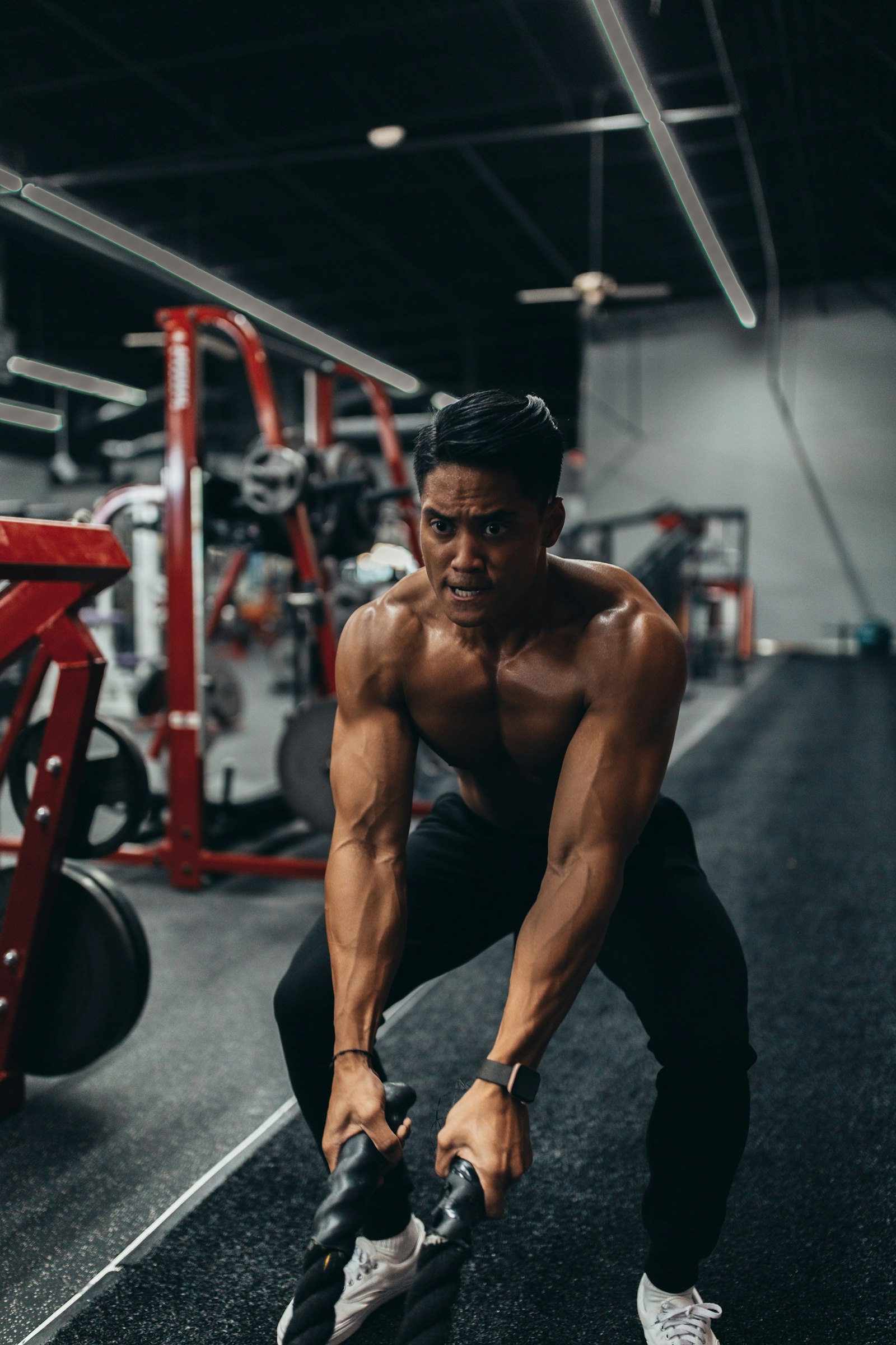 Athlete mid-squat in the gym