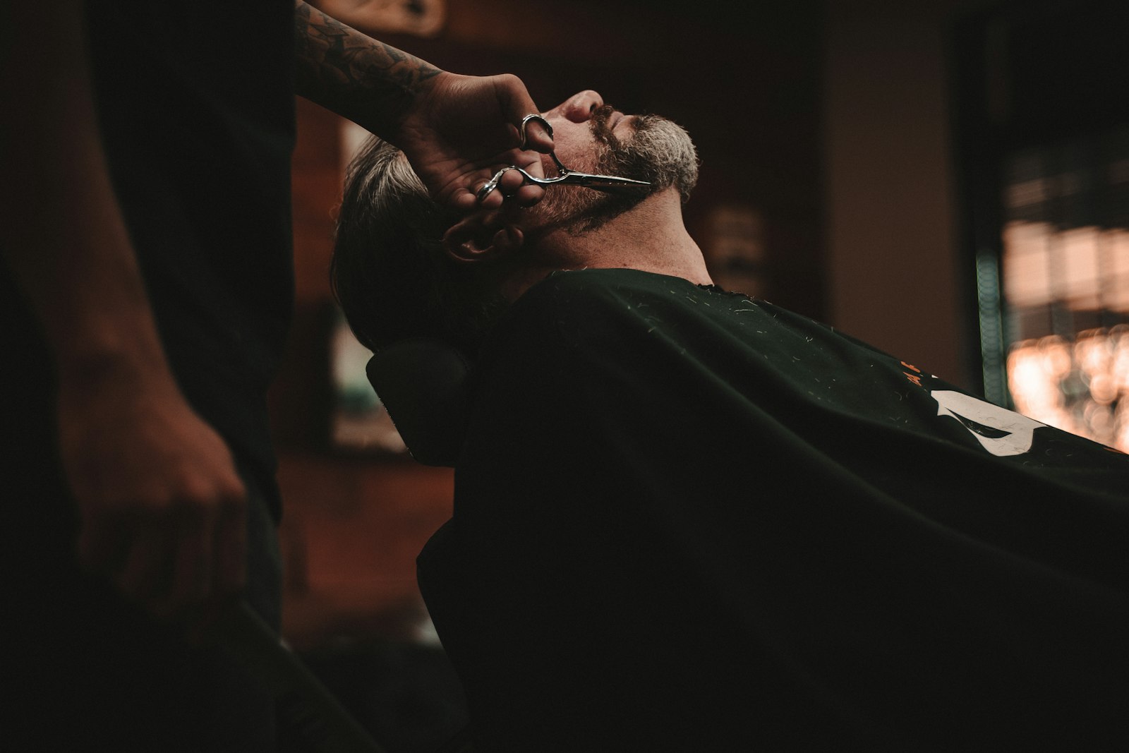 Client in the barber chair, low light