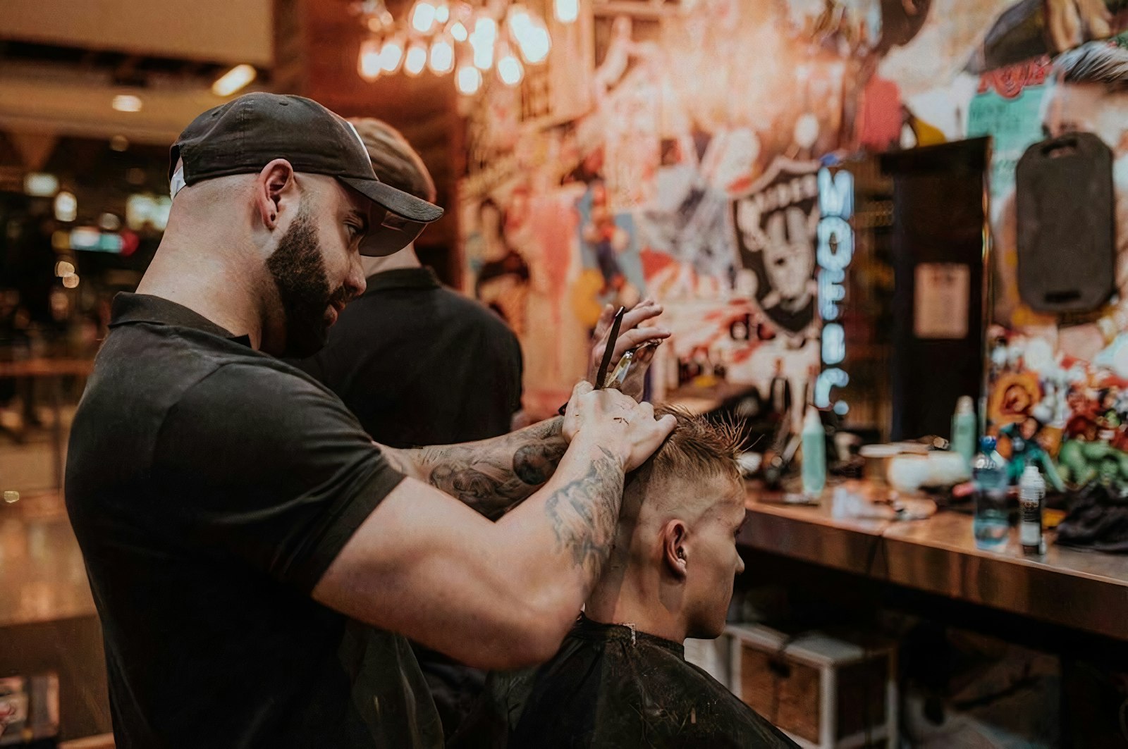 Barber cutting hair in the shop