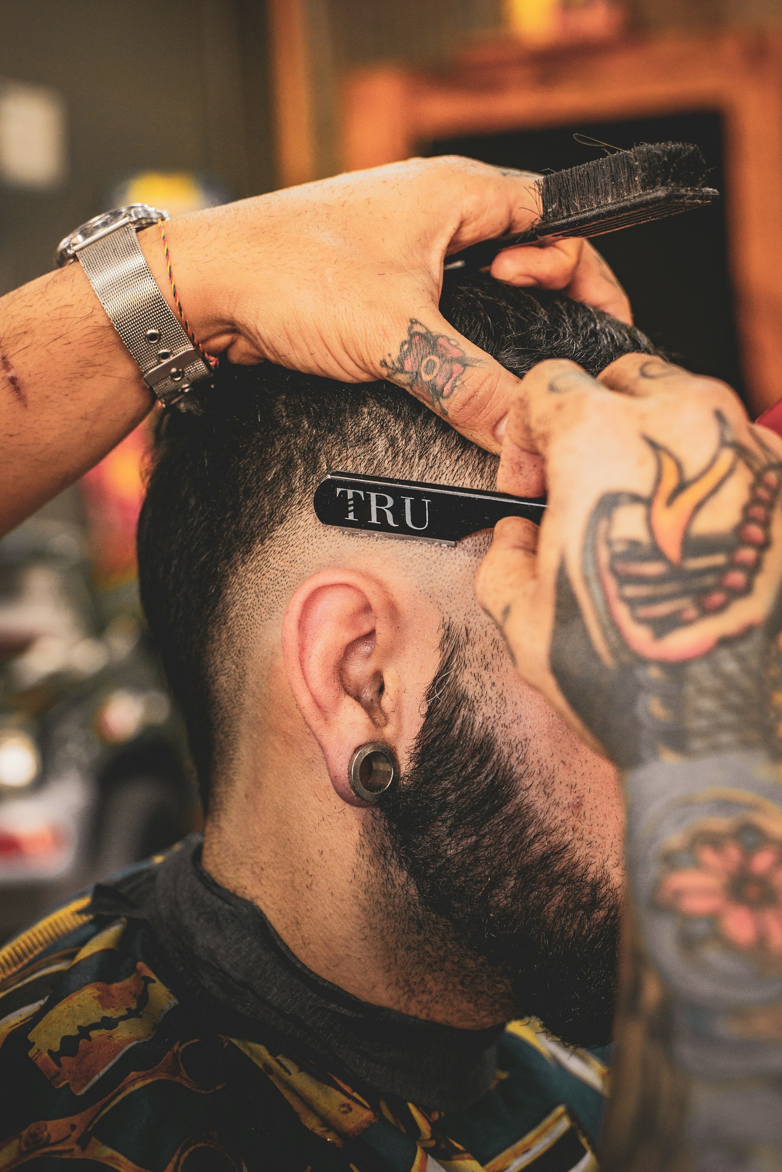 Barber detailing a fresh cut