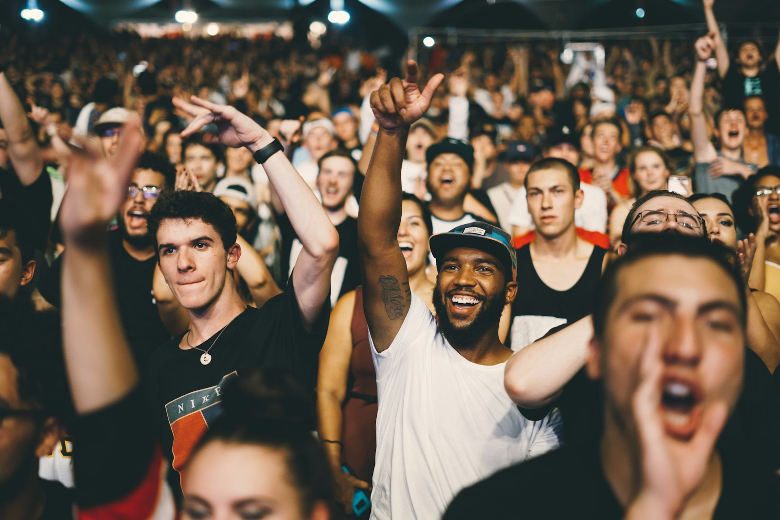 Concert crowd with hands raised