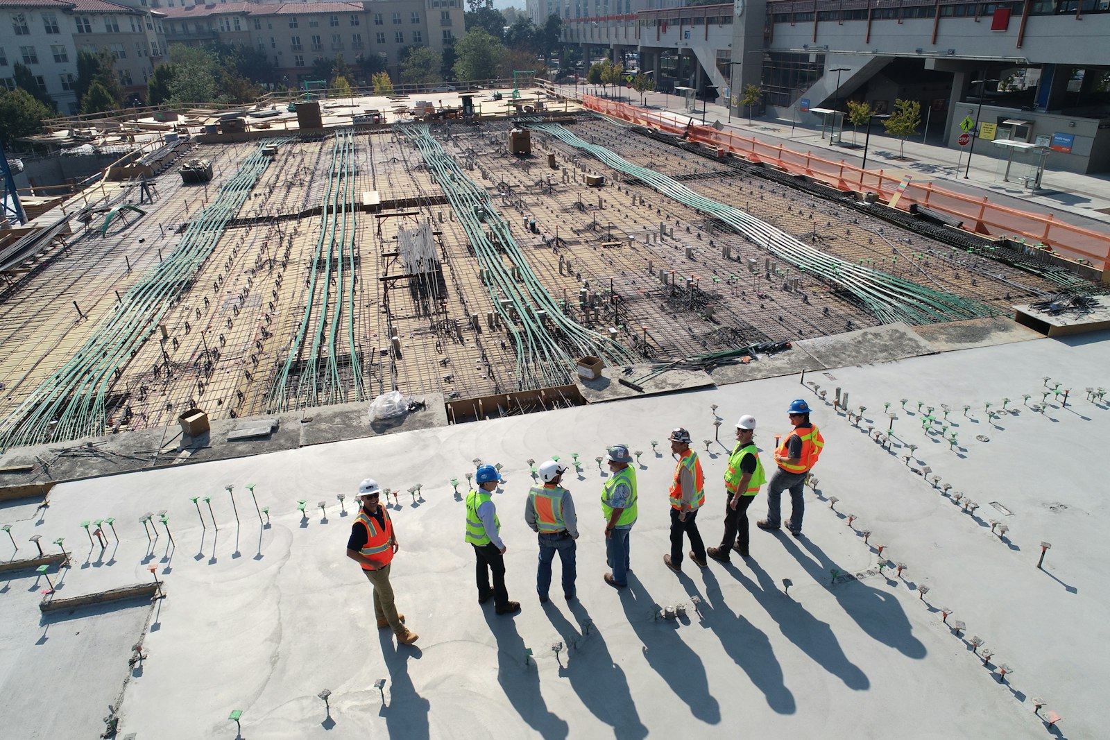 Crew on a concrete slab at a construction site