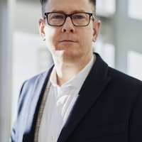 Executive in a suit and glasses