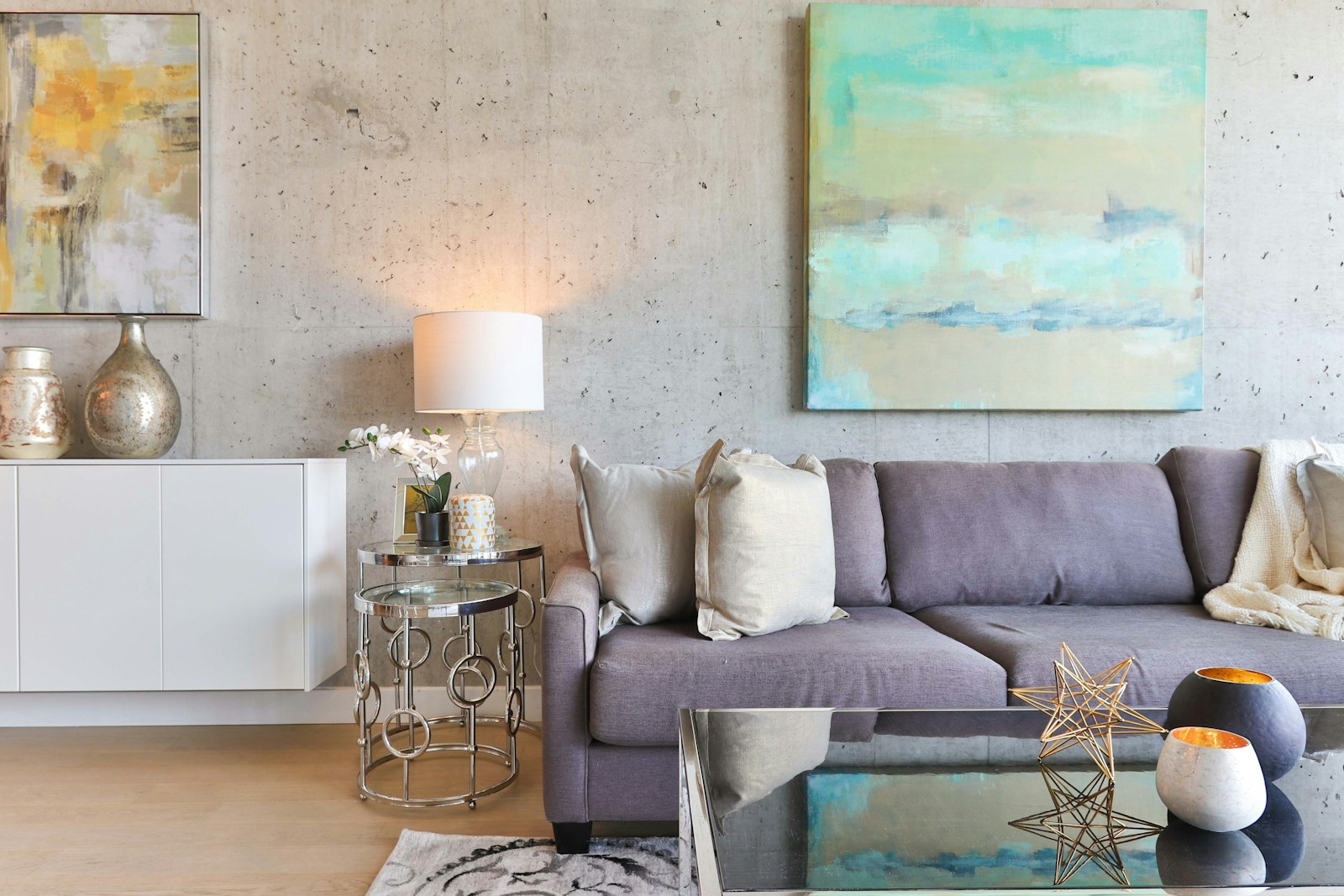 Grey sofa living room with abstract paintings