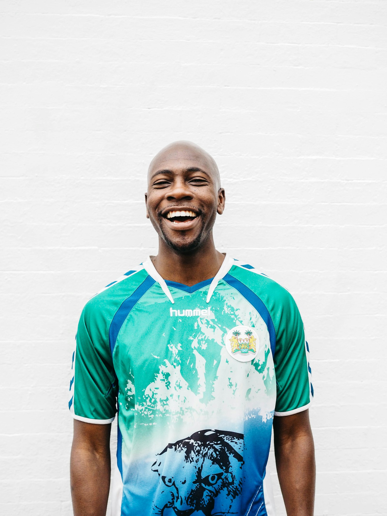 Smiling man in a sports jersey