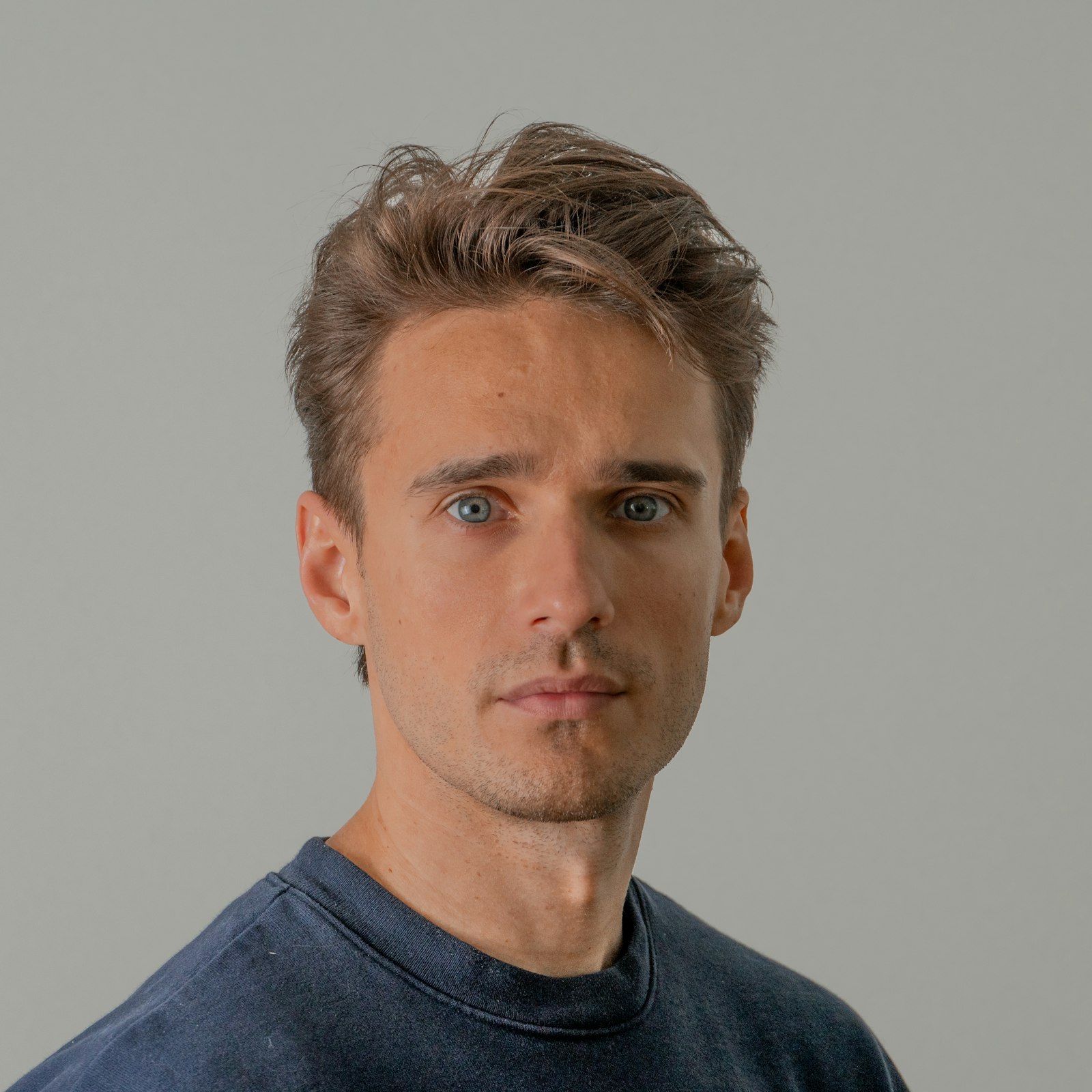 Clean-cut man on a neutral backdrop