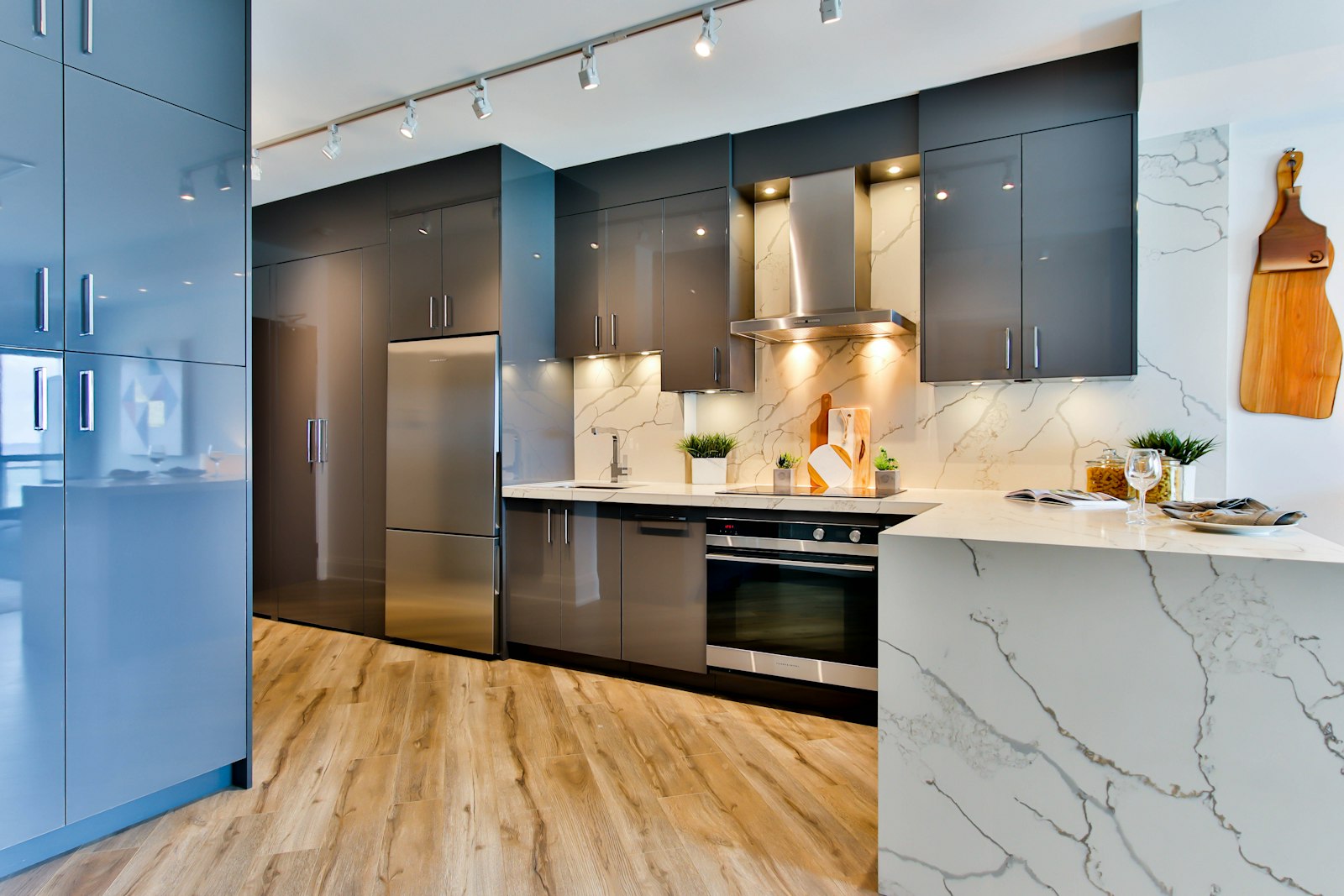 Modern kitchen with marble counter and glossy cabinets