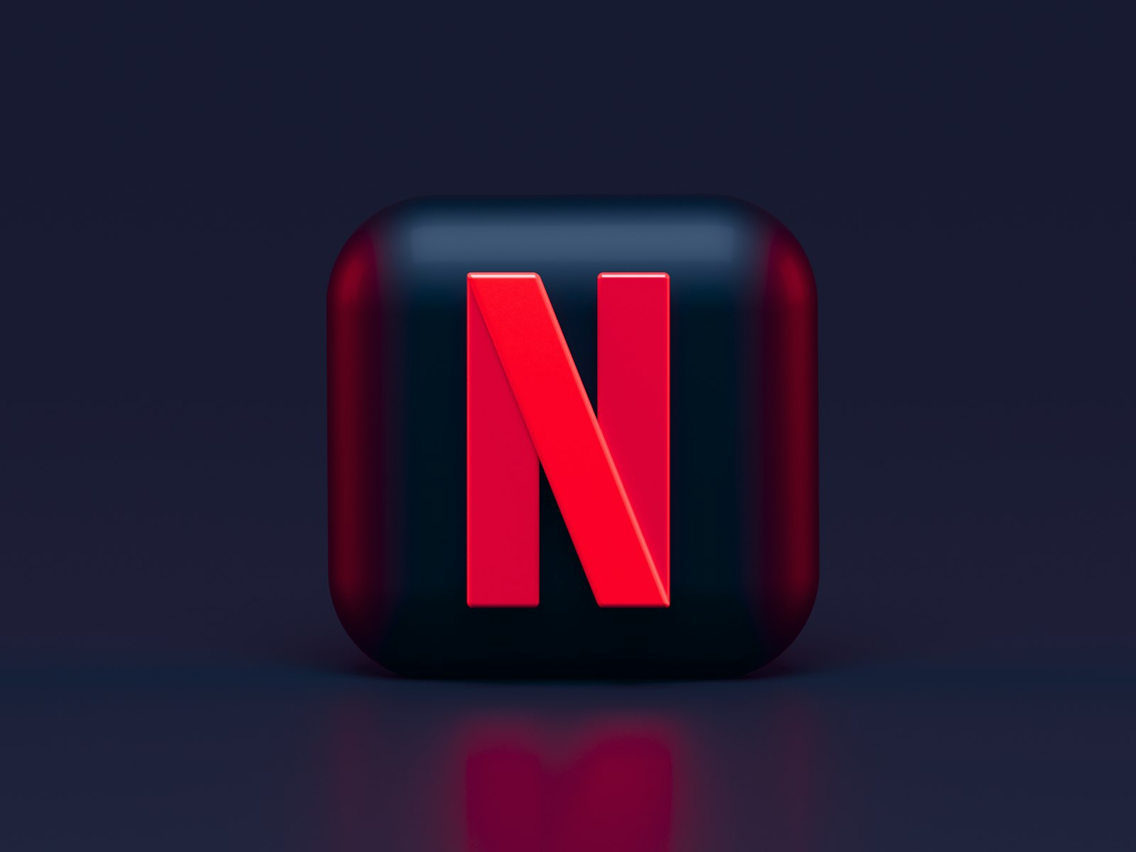 Three-dimensional Netflix icon on a dark background