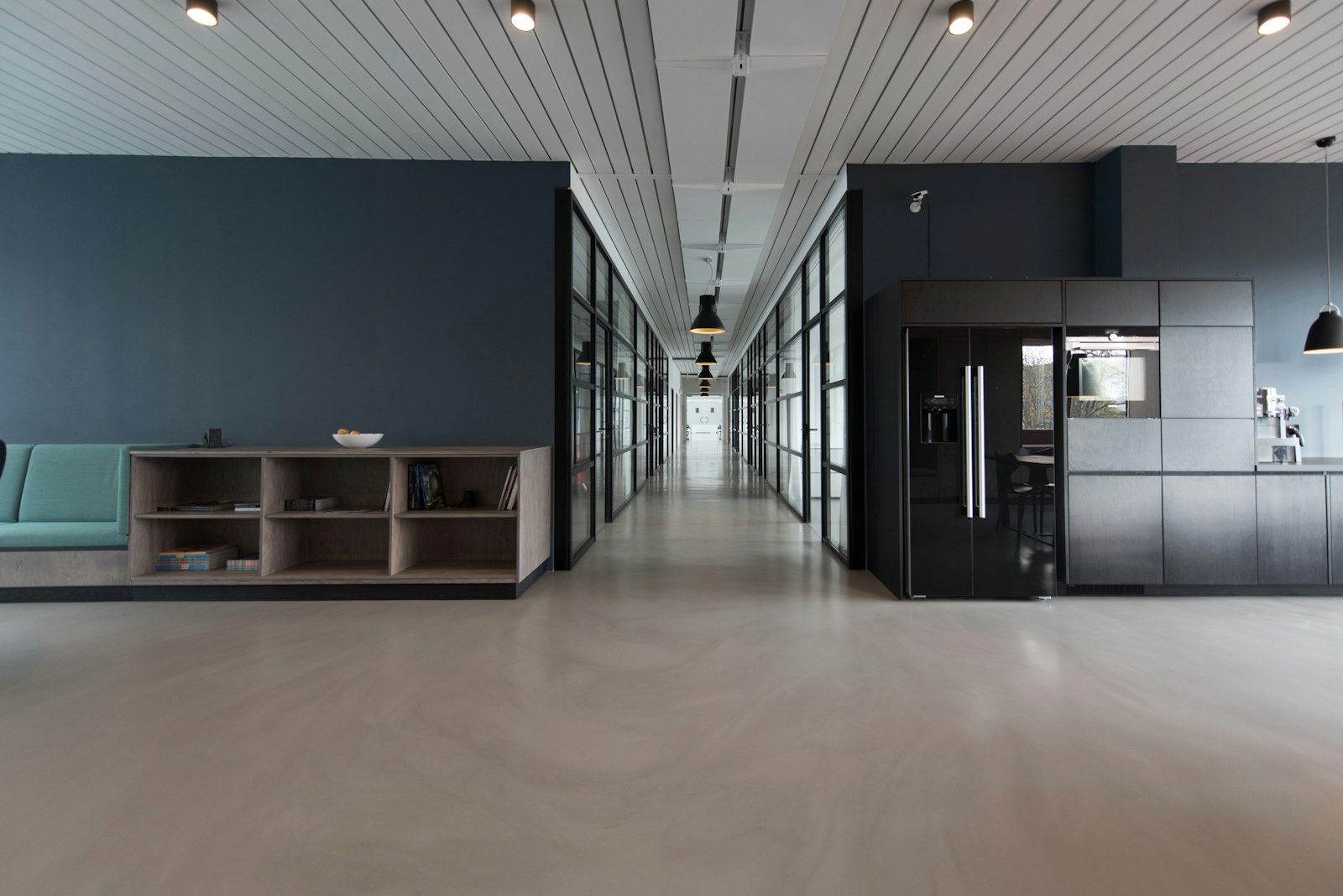 Modern office corridor with glass partitions