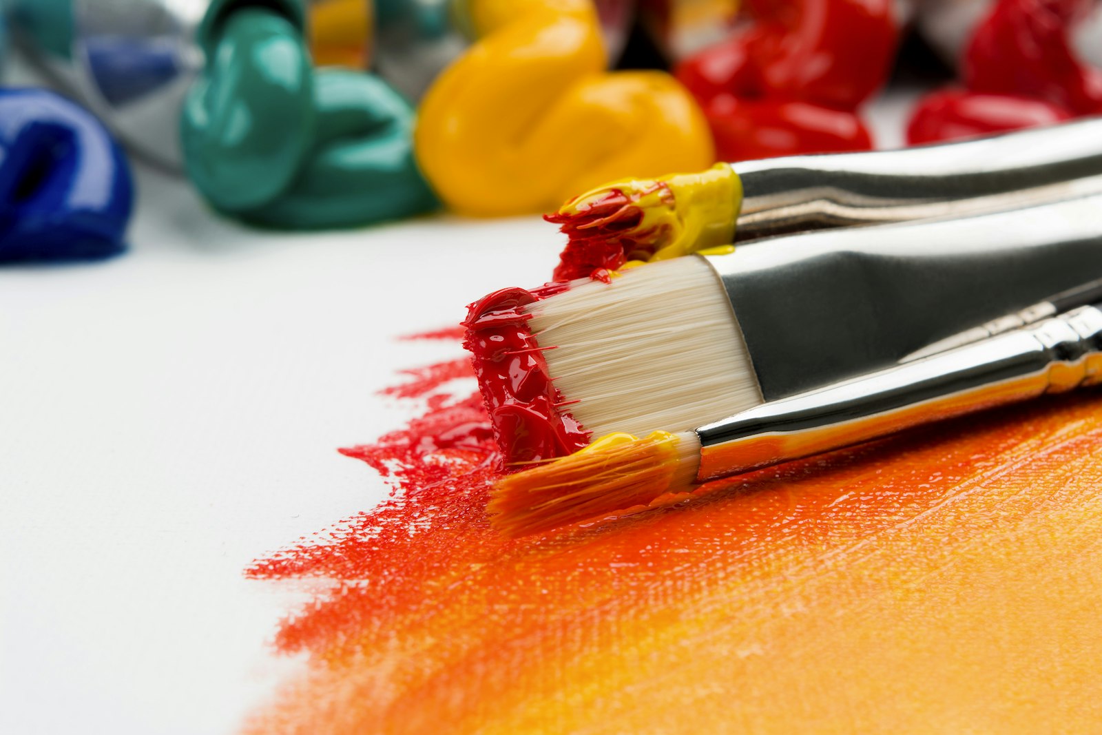 Paintbrush loaded with red paint