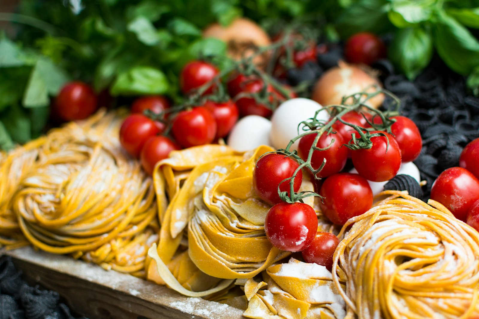 Fresh pasta and tomatoes on the table