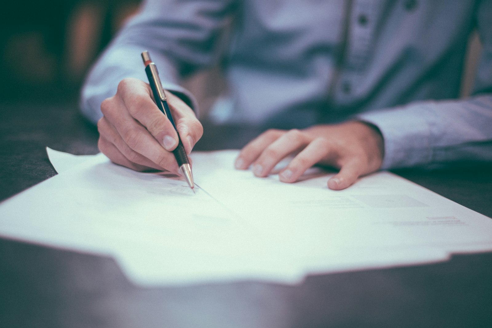 Signing a document with a fountain pen