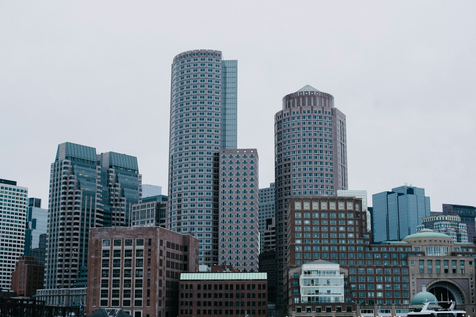City skyline of towers under overcast sky