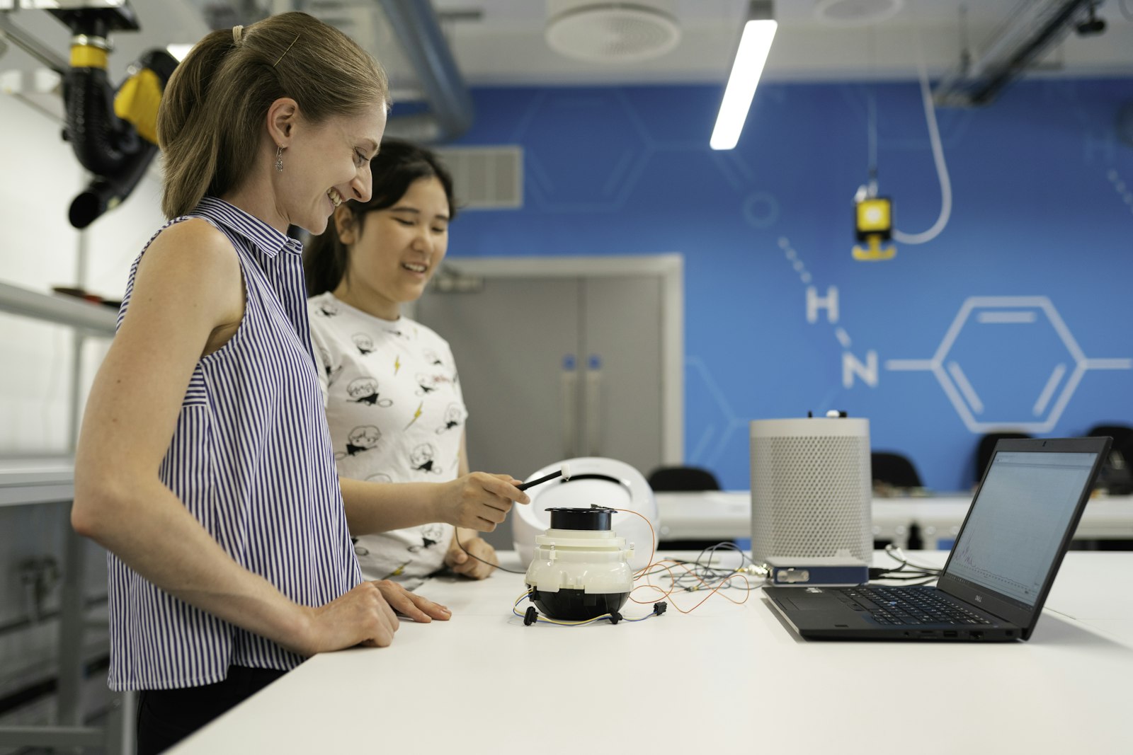Students working with a robot in a STEM lab