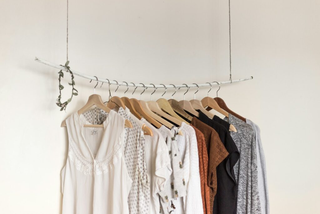 Neutral garments hanging on a suspended rail