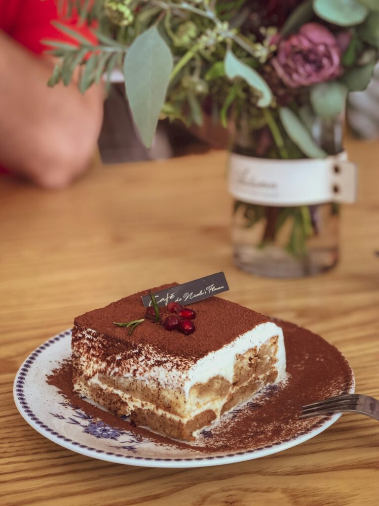 Slice of tiramisu on a cafe plate