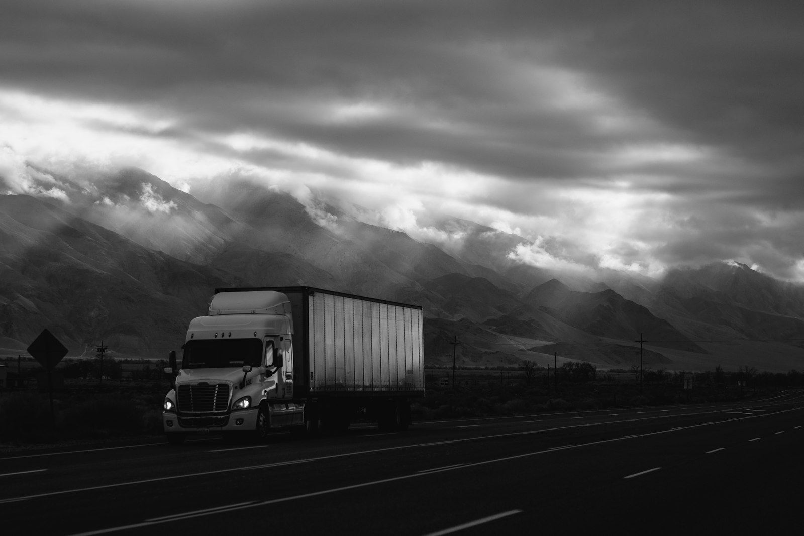 Truck on a misty mountain road