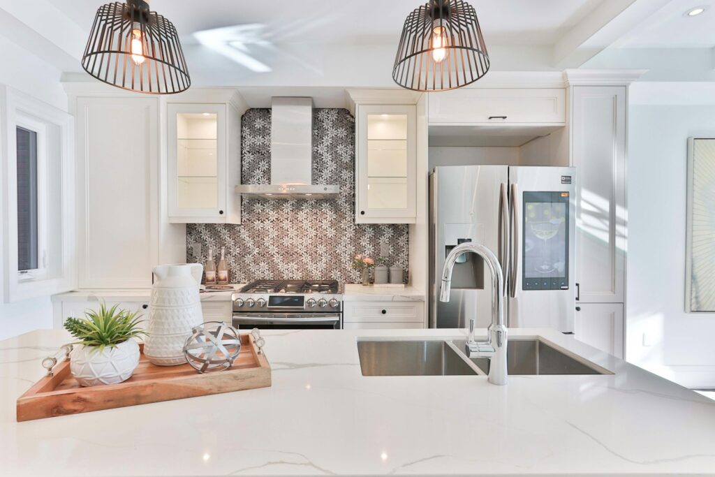 Bright white kitchen with island and pendant lights